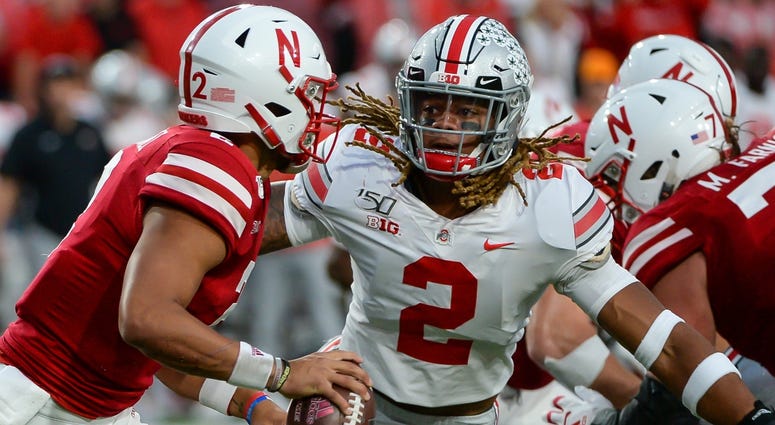 Ohio State defensive end Chase Young (2) pressures Nebraska quarterback Adrian Martinez, left. Ohio State defensive end Chase Young (2) pressures Nebraska quarterback Adrian Martinez, left.