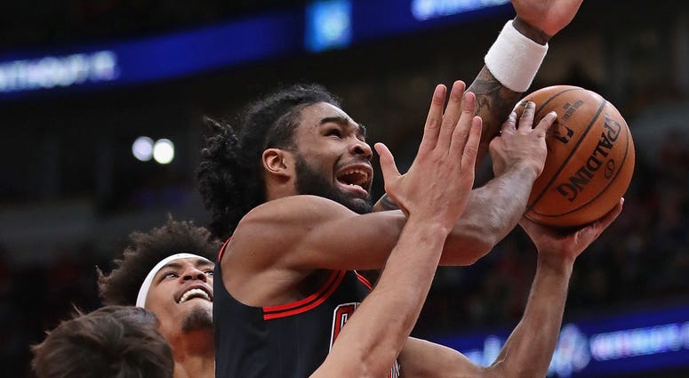 Bulls guard Coby White drives to the hoop against the Suns. Bulls guard Coby White drives to the hoop against the Suns.