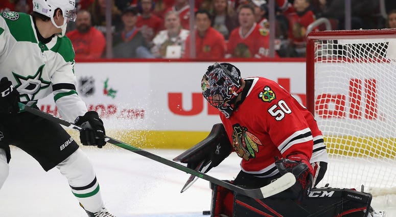Blackhawks goalie Corey Crawford, right, makes a stop against Stars forward Denis Gurianov. Blackhawks goalie Corey Crawford, right, makes a stop against Stars forward Denis Gurianov.