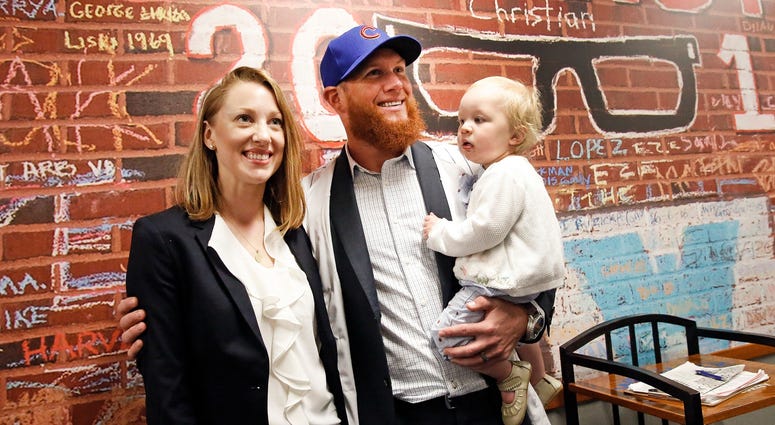 New Cubs closer Craig Kimbrel, center, poses for photos at his introduction with his wife Ashely and their daughter Lydia Joy. New Cubs closer Craig Kimbrel, center, poses for photos at his introduction with his wife Ashely and their daughter Lydia Joy.