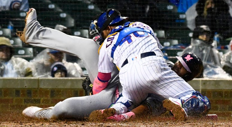 Cubs catcher Willson Contreras (40) tags out Brewers first baseman Jesus Aguilar (24). Cubs catcher Willson Contreras (40) tags out Brewers first baseman Jesus Aguilar (24).