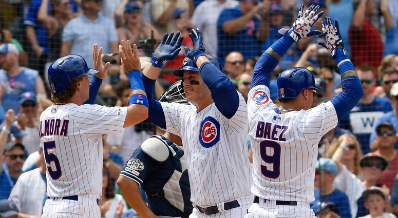 Cubs first baseman Anthony Rizzo (44) celebrates with center fielder Albert Almora Jr. (5) after hitting a grand slam. Cubs first baseman Anthony Rizzo (44) celebrates with center fielder Albert Almora Jr. (5) after hitting a grand slam.