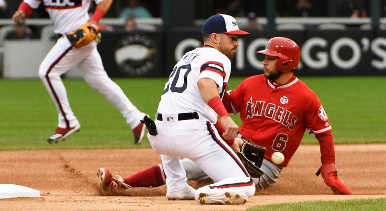 Angels shortstop David Fletcher (6) steals second base as White Sox shortstop Danny Mendick (20) makes a late tag. Angels shortstop David Fletcher (6) steals second base as White Sox shortstop Danny Mendick (20) makes a late tag.