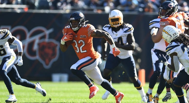 Bears running back David Montgomery (32) carries the ball against the Chargers. Bears running back David Montgomery (32) carries the ball against the Chargers.