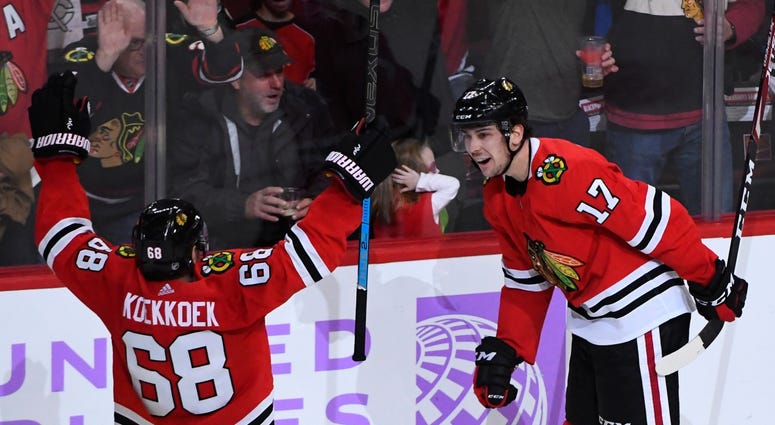 Blackhawks defenseman Slater Koekkoek (68) and center Dylan Strome (17) react after Strome scored a goal against the Kings. Blackhawks defenseman Slater Koekkoek (68) and center Dylan Strome (17) react after Strome scored a goal against the Kings.