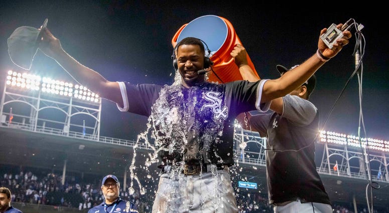 White Sox outfielder Eloy Jimenez (74) is doused after homering to lift his team to a win against the Cubs. White Sox outfielder Eloy Jimenez (74) is doused after homering to lift his team to a win against the Cubs.