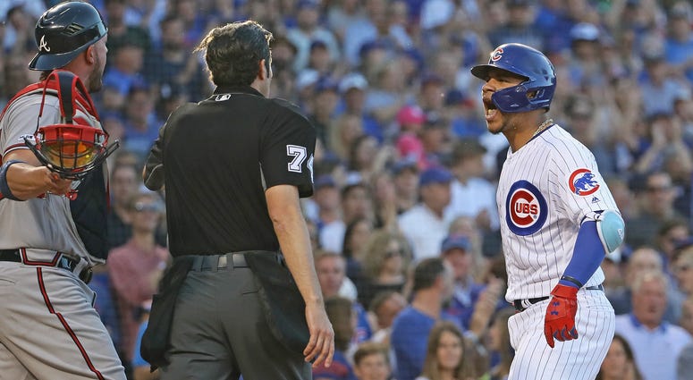 Cubs catcher Willson Contreras, shouts at Braves catcher Tyler Flowers. Cubs catcher Willson Contreras, shouts at Braves catcher Tyler Flowers.