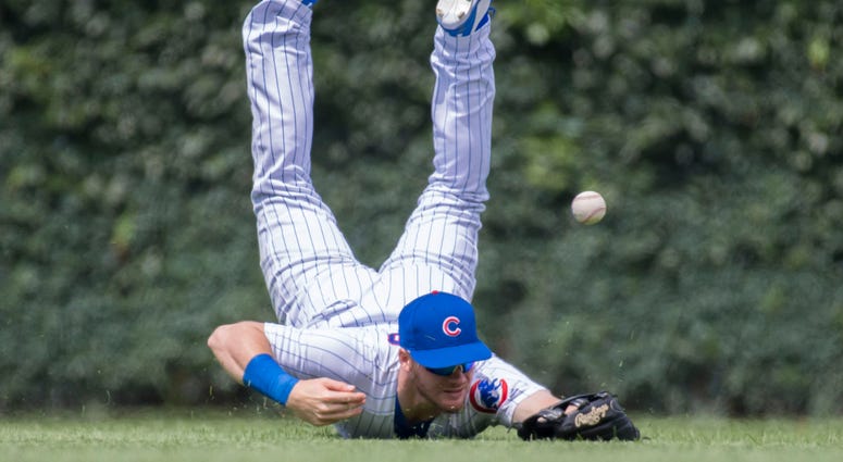 Cubs outfielder Ian Happ can't corral an eventual double by the Dodgers. Cubs outfielder Ian Happ can't corral an eventual double by the Dodgers.
