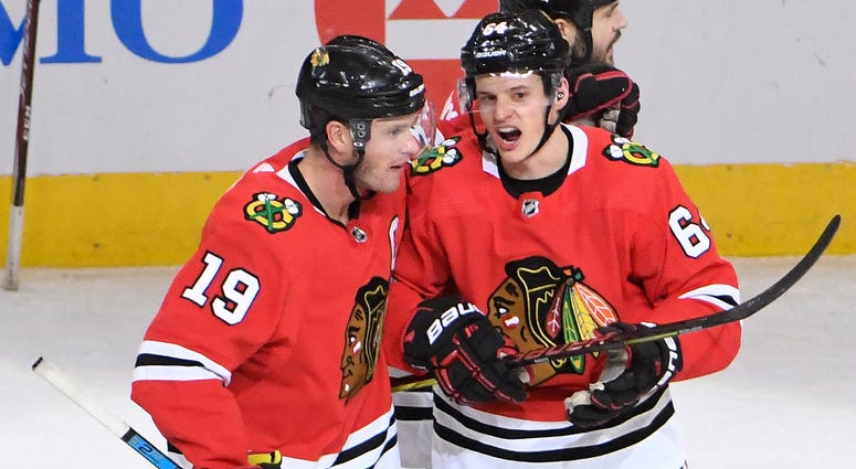Blackhawks forward David Kampf (64) celebrates with center Jonathan Toews (19) after scoring a goal against the Canucks. Blackhawks forward David Kampf (64) celebrates with center Jonathan Toews (19) after scoring a goal against the Canucks.