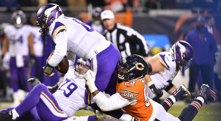 Vikings quarterback Kirk Cousins (8) is sacked by Bears linebacker Khalil Mack (52). Vikings quarterback Kirk Cousins (8) is sacked by Bears linebacker Khalil Mack (52).