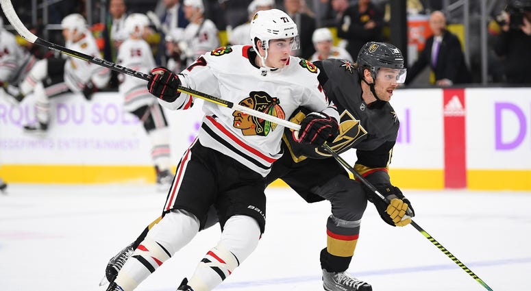 Blackhawks center Kirby Dach (77) skates against Golden Knights defenseman Jon Merrill (15). Blackhawks center Kirby Dach (77) skates against Golden Knights defenseman Jon Merrill (15).