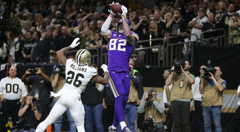 Vikings tight end Kyle Rudolph (82) catches a pass for the winning touchdown over Saints cornerback P.J. Williams (26) in overtime of a wild-card round matchup. Vikings tight end Kyle Rudolph (82) catches a pass for the winning touchdown over Saints cornerback P.J. Williams (26) in overtime of a wild-card round matchup.