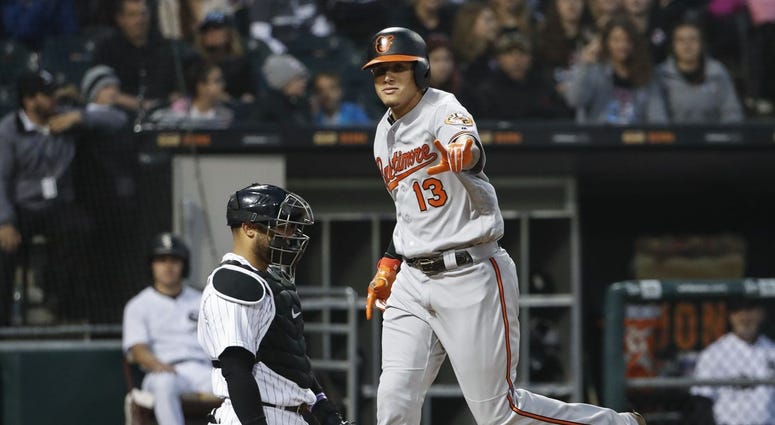 Orioles shortstop Manny Machado crosses home plate after homering. Orioles shortstop Manny Machado crosses home plate after homering.