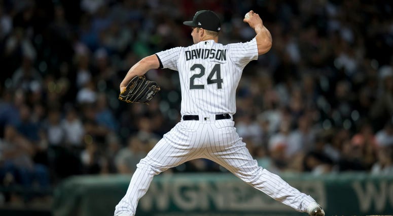 White Sox infielder Matt Davidson pitches. White Sox infielder Matt Davidson pitches.