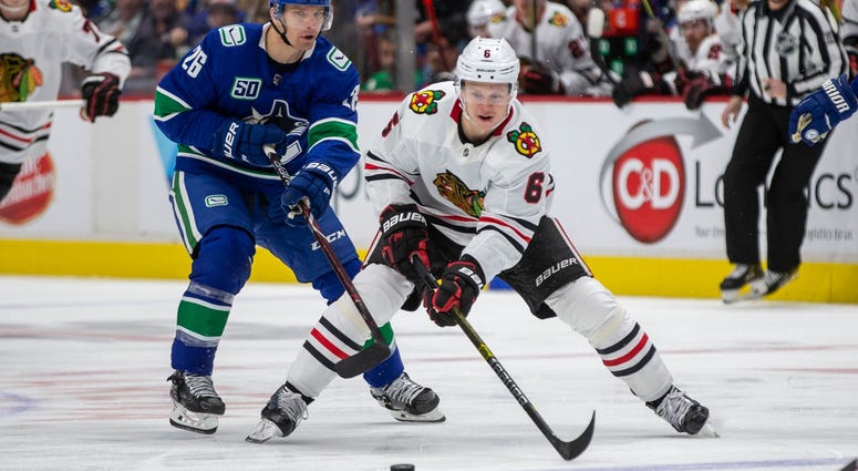 Blackhawks defenseman Olli Maatta skates with the puck against the Canucks. Blackhawks defenseman Olli Maatta skates with the puck against the Canucks.