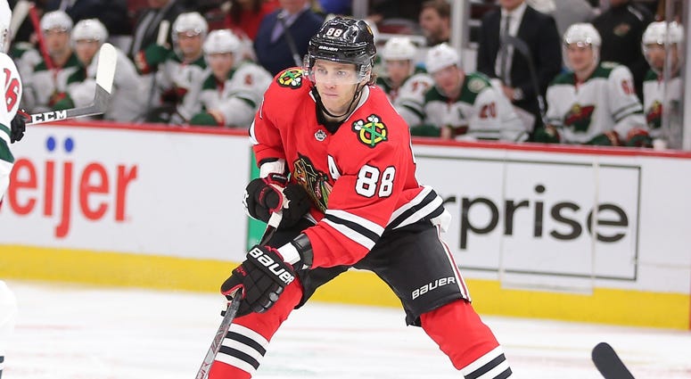 Blackhawks right wing Patrick Kane (88) handles the puck against the Wild. Blackhawks right wing Patrick Kane (88) handles the puck against the Wild.