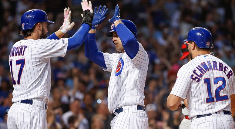 Cubs first baseman Anthony Rizzo (44) celebrates with third baseman Kris Bryant (17) after hitting a homer. Cubs first baseman Anthony Rizzo (44) celebrates with third baseman Kris Bryant (17) after hitting a homer.