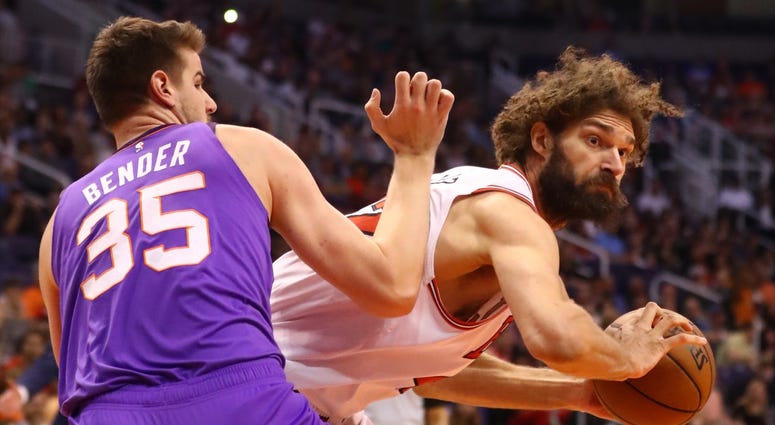 Bulls center Robin Lopez (right) works against Suns forward Dragan Bender (35). Bulls center Robin Lopez (right) works against Suns forward Dragan Bender (35).