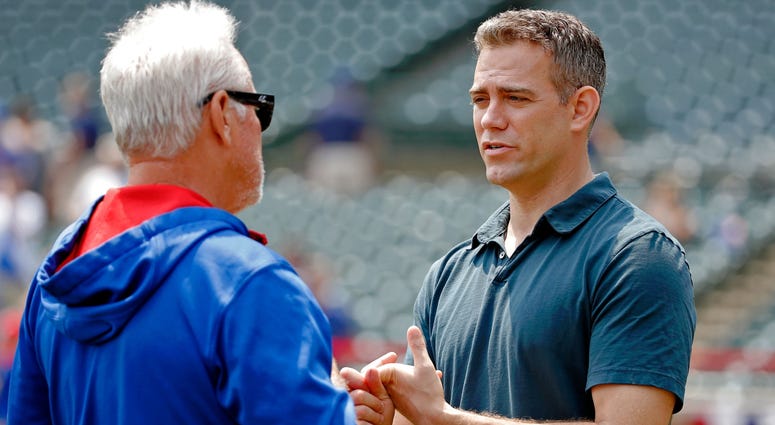 Cubs manager Joe Maddon, left, and president of baseball operations Theo Epstein have a conversation in 2015. Cubs manager Joe Maddon, left, and president of baseball operations Theo Epstein have a conversation in 2015.