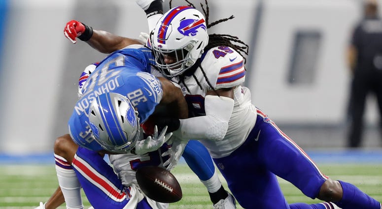 Lions running back Ty Johnson (38) fumbles the ball against Bills cornerback Kevin Johnson (36) and middle linebacker Tremaine Edmunds (49). Lions running back Ty Johnson (38) fumbles the ball against Bills cornerback Kevin Johnson (36) and middle linebacker Tremaine Edmunds (49).
