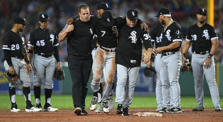 White Sox shortstop Tim Anderson (center) is helped off the after suffering an injury. White Sox shortstop Tim Anderson (center) is helped off the after suffering an injury.
