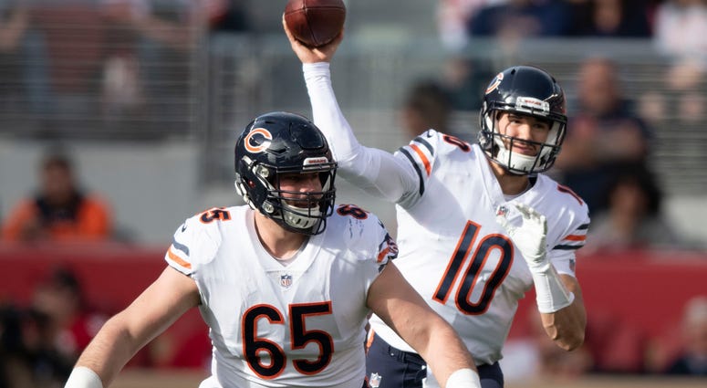 Bears quarterback Mitchell Trubisky (10) throws a pass behind center Cody Whitehair (65). Bears quarterback Mitchell Trubisky (10) throws a pass behind center Cody Whitehair (65).