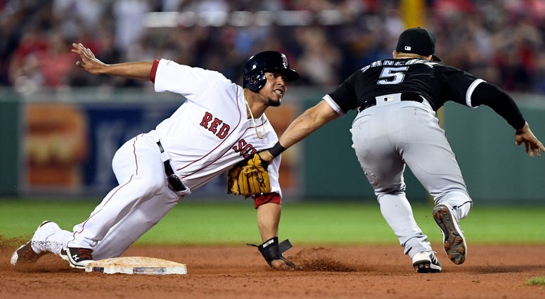 Red Sox third baseman Marco Hernandez (40) slides safely into second base as White Sox second baseman Yolmer Sanchez (5) attempts a tag. Red Sox third baseman Marco Hernandez (40) slides safely into second base as White Sox second baseman Yolmer Sanchez (5) attempts a tag.