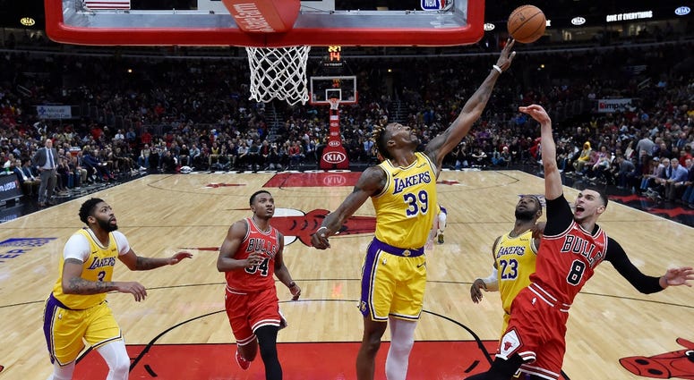 Lakers center Dwight Howard (39) blocks the shot of Bulls guard Zach LaVine (8). Lakers center Dwight Howard (39) blocks the shot of Bulls guard Zach LaVine (8).