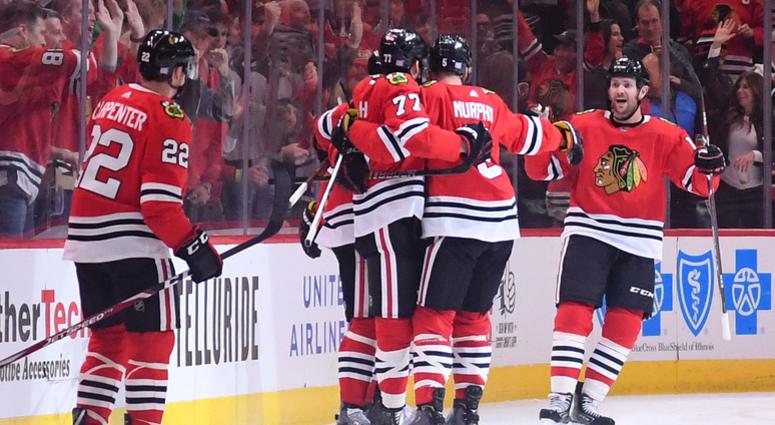 Blackhawks center Kirby Dach (77) reacts after scoring a goal against the Sabres. Blackhawks center Kirby Dach (77) reacts after scoring a goal against the Sabres.