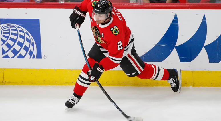 Blackhawks defenseman Duncan Keith (2) attempts a shot against the Canucks. Blackhawks defenseman Duncan Keith (2) attempts a shot against the Canucks.