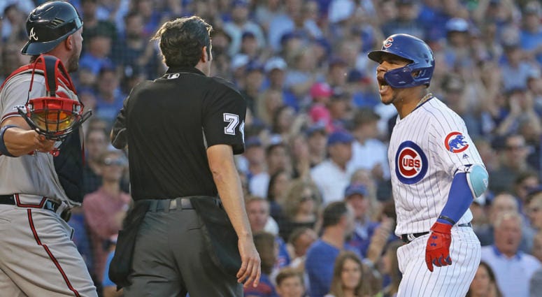 Cubs catcher Willson Contreras, shouts at Braves catcher Tyler Flowers. Cubs catcher Willson Contreras, shouts at Braves catcher Tyler Flowers.