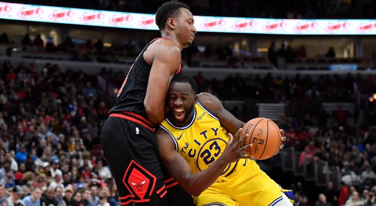 Warriors forward Draymond Green (23) is fouled driving against Bulls center Wendell Carter Jr. (34). Warriors forward Draymond Green (23) is fouled driving against Bulls center Wendell Carter Jr. (34).