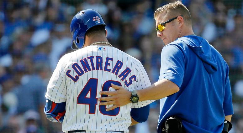 Cubs catcher Willson Contreras (40) walks off the field with head trainer PJ Mainville after suffering a hamstring injury. Cubs catcher Willson Contreras (40) walks off the field with head trainer PJ Mainville after suffering a hamstring injury.