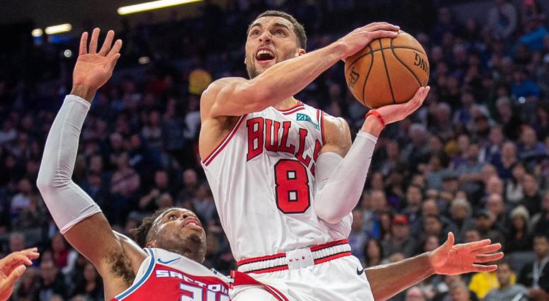 Bulls guard Zach LaVine (8) goes up for the shot against Kings guard Buddy Hield (24). Bulls guard Zach LaVine (8) goes up for the shot against Kings guard Buddy Hield (24).