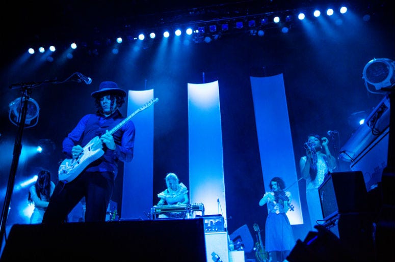 SEATTLE - AUGUST 14: Rock Star Jack White plays guitar on stage at WaMu Theater in Seattle, WA on August 14, 2012. SEATTLE - AUGUST 14: Rock Star Jack White plays guitar on stage at WaMu Theater in Seattle, WA on August 14, 2012.