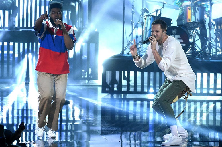 Khalid and Dan Reynolds of music group Imagine Dragons perform at the 2017 American Music Awards Khalid and Dan Reynolds of music group Imagine Dragons perform at the 2017 American Music Awards