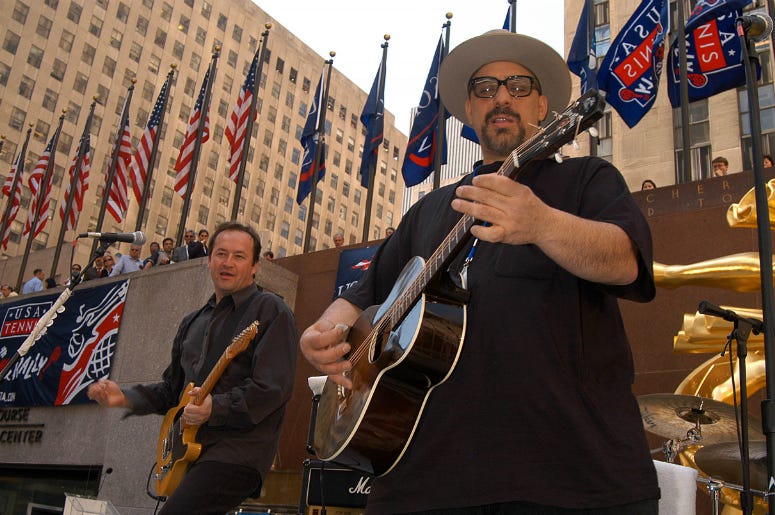 Pat DiNizio (right) performs with The Smithereens for the launch celebration of 'USA tennis month' at Rockefeller Center. Pat DiNizio (right) performs with The Smithereens for the launch celebration of 'USA tennis month' at Rockefeller Center.