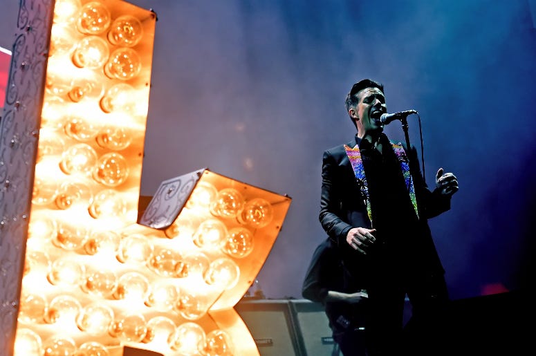 Brandon Flowers of The Killers performs onstage during the grand opening of T-Mobile Arena Brandon Flowers of The Killers performs onstage during the grand opening of T-Mobile Arena