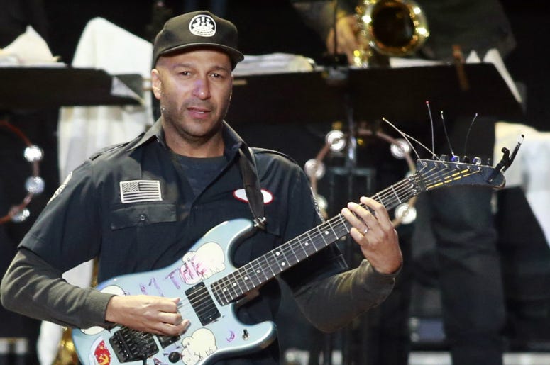 Tom Morello during the March Madness Music Festival at Reunion Park. Tom Morello plays guitar during the March Madness Music Festival with Bruce Springsteen (not pictured) and the E Street Band at Reunion Park.