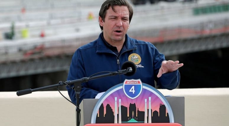 Florida Gov. Ron DeSantis speaks at a news conference May 18, 2020, in Orlando. The governor announced that the I-4 and State Road 408 interchange has opened.