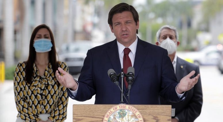 Florida Gov. Ron DeSantis speaks at a news conference during the new coronavirus pandemic, Thursday, May 14, 2020, in Doral, Fla. DeSantis has signed an executive order for the reopening of Miami-Dade and Broward counties on May 18.