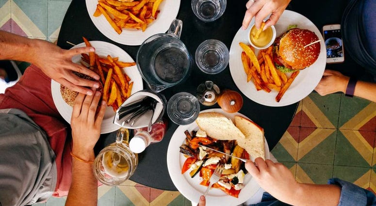 Patrons dine at a restaurant Friday, Oct. 2, 2020, in Winter Park, Fla. In his drive to return the state to normalcy, Republican Gov. Ron DeSantis lifted limits on indoor seating at restaurants, saying they can operate at 100%.