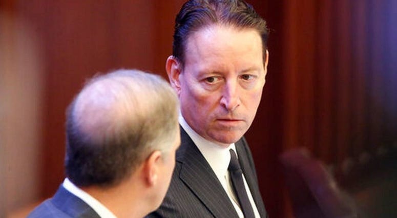 Senate president Bill Galvano, R-Bradenton, right, confers with Sen. Wilton Simpson, R-Trilby, during a session Friday March 13, 2020 in Tallahassee, Fla. The spread of the new coronavirus has stoked worries about Florida's economy.
