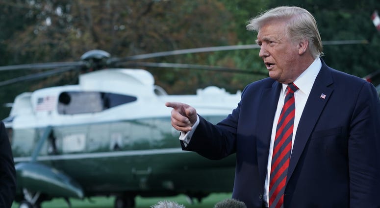 U.S. President Donald Trump speaks to members of the media prior to a departure from the White House September 12, 2019
