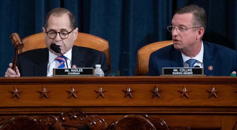 U.S. Judiciary Committee Chairman Jerrold Nadler (D-NY) gavels the committee meeting adjourned as ranking member Doug Collins (R-GA) looks on following testimony by constitutional scholars in the Longworth House Office Building on Capitol Hill December 4,