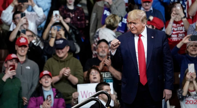 Supporters cheer as U.S. President Donald Trump arrives for a "Keep America Great" rally at Southern New Hampshire University Arena on February 10, 2020 in Manchester, New Hampshire.