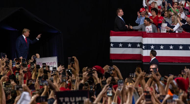 Supporters cheer as President Donald Trump arrives at a rally at the Arizona Veterans Memorial Coliseum on February 19, 2020 in Phoenix, Arizona. President Trump says he will be visiting Arizona frequently in the lead up to the 2020 election.