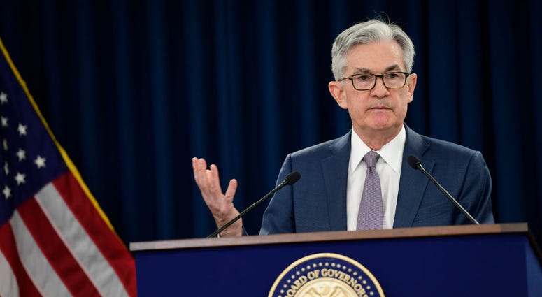 Federal Reserve Chair Jerome H. Powell announces a half percentage point interest rate cut