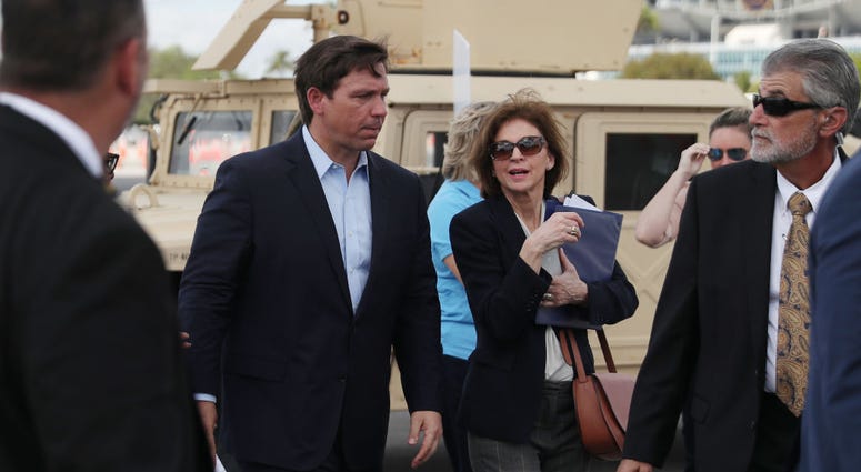 Florida Gov. Ron DeSantis attends a news conference in the Hard Rock Stadium parking lot in Miami Gardens, Florida.