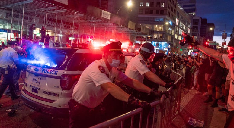 Police confront protesters in Union Square on May 30, 2020 in New York City. Across the country, protests against George Floyd's Minneapolis death have set off days and nights violence.